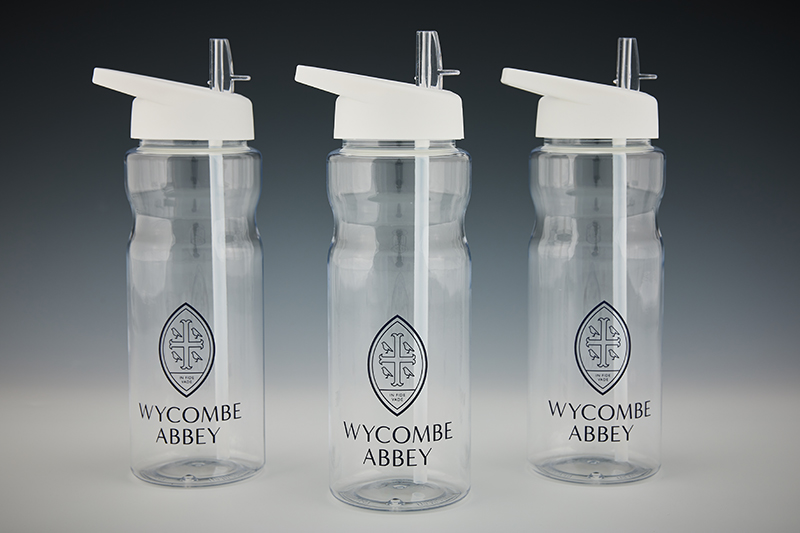  Three clear water bottles with a navy Wycombe Abbey logo.